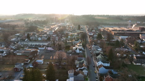 Reverse-dolly-aerial-shot-of-American-town-in-winter