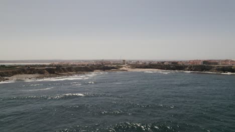 Dolly-right-Aerial-view-Peniche-Coastline-beach-view-from-Ocean,-Portugal