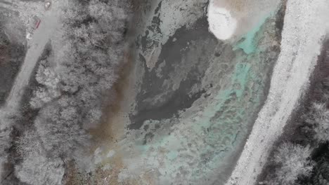aerial-circular-topdown-view-of-cold-clean-mountain-river-in-freezing-winter-morning