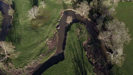 An-aerial-view-of-the-winding-River-Arrow-running-through-the-Warwickshire-countryside-in-England