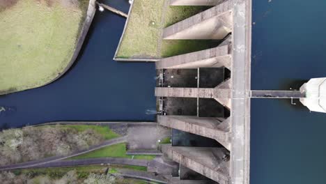 Aerial-Top-Down-View-Of-High-Walled-Concrete-Dam-At-Wimbleball-Lake