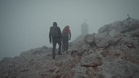 Hikers-are-climbing-up-to-the-peak-of-mountain-Triglav-to-reach-Aljaž-Tower