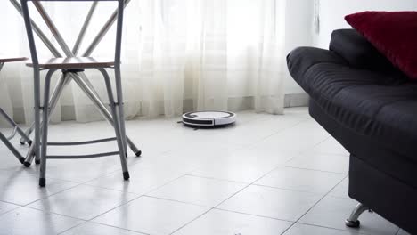 robot-vacuum-cleaner-working-at-the-living-room