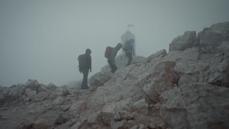 Hikers-are-climbing-up-towards-the-peak-of-mountain-Triglav-to-reach-Aljaž-Tower