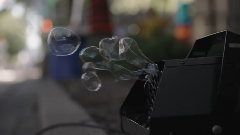 Slow-motion-footage-of-bubbles-getting-blown-out-of-a-machine