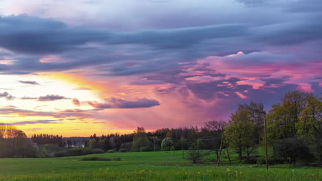 Timelapse-of-colourful-clouds-moving-over-rural-landscape