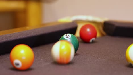 Colorful-Billiard-Balls-Rolling-On-The-Billiard-Table