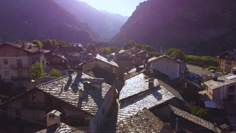 Italian-alps-village-on-a-sunny-day,-aerial-drone-view-with-forward-motion