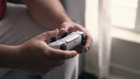 Close-up-of-hands-playing-modern-console-video-game