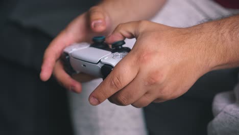 Man-with-joystick-in-hand-plays-video-game
