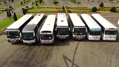 Aerial-drone-view-of-a-line-of-parked-busses