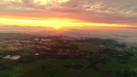 Drone-flying-over-European-landscape-at-sunset