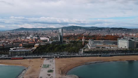 AERIAL:-Barcelona,-Spain-Wide-Drone-Shot-of-City-and-Ocean