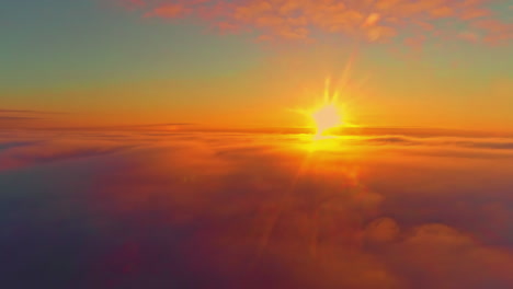 Vibrant-colored-Sunset-view-from-above-the-clouds,-Aerial-wide-shot