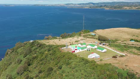 Aerial-360-View-Of-The-Punta-Corona-Lighthouse-Located-At-Chiloe-Island-In-Chile
