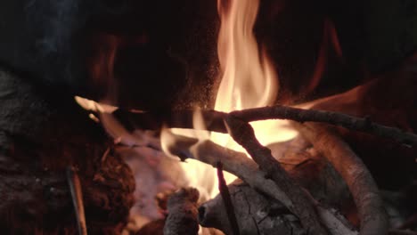 Close-up-slomo-shot-of-burning-wood-at-campfire