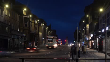 4K-Stylised-Timelapse-of-a-busy-Road-Intersection-at-Dusk-in-Edinburgh-in-Scotland-in-United-Kingdom-with-cars-and-people-passing-by