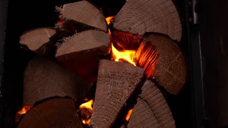 Close-Up-Of-Pile-Of-Wood-Logs-Burning-To-Heat-Hot-Tub
