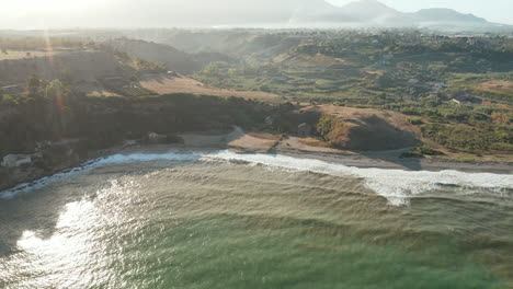 Foamy-Waves-Splashing-On-Sandy-Shore-Of-Città-del-Mare-Perla-Del-Golfo-In-Sicily,-Italy---aerial-drone-shot