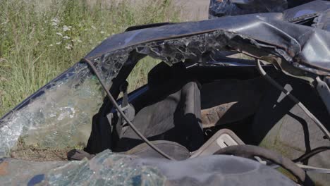 News-coverage-editorial-shot-of-wrecked-accident-car-windshield-in-scrap