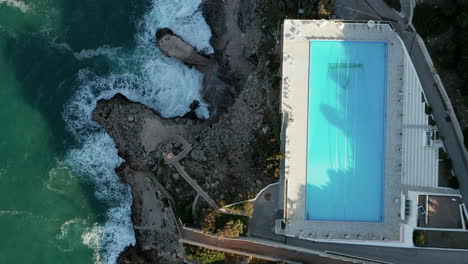 Overhead-View-Of-An-Infinity-Pool-At-Perla-del-Golfo-Resort-In-Terrasini,-Province-of-Palermo,-Sicilia,-Italy