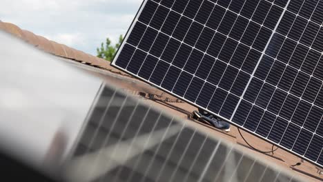 Consumer-solar-panel-being-installed-on-customer's-house-roof,-sustainable-energy