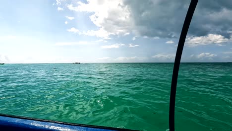 Navigating-on-board-of-motor-boat-in-Mnemba-Island,-Zanzibar,-Tanzania