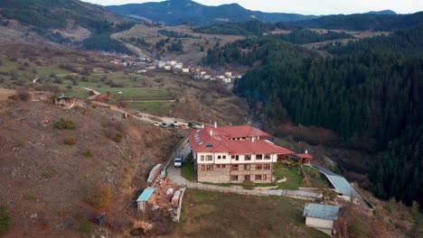 Aerial-view-of-building-in-Rhodope-mountains-standing-on-a-cliff
