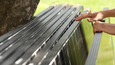 Solar-panel-installer-inspecting-panels-for-installation-to-produce-green-power