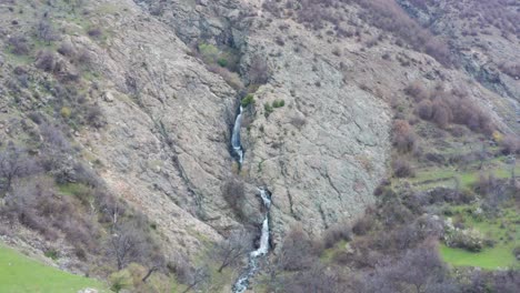 Aerial-review-of-Sopot-waterfall-hidden-between-rocky-mountains