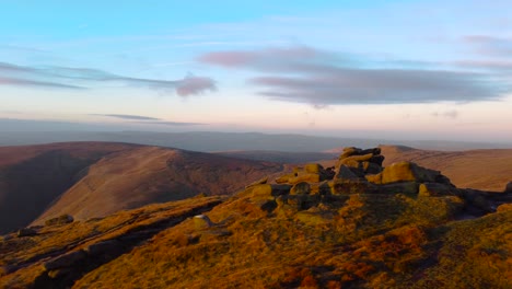 Aerial-flight-above-Kinder-Scout-Mountains-during-sunset-time-at-Peak-District,England