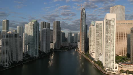 Drone-shot-Miami-city-skyline-in-Florida-with-skyscrapers-and-sun,-USA