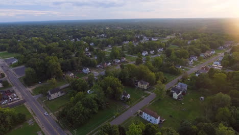 Forward-and-Panning-down-drone-shot-of-houses-on-a-late-summer-day-in-Youngstown-Ohio