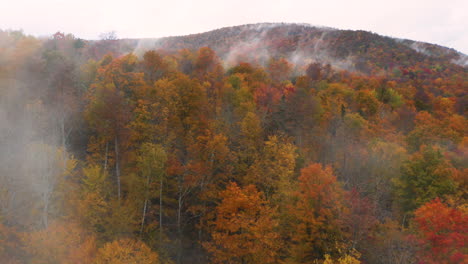 Low-hanging-clouds-rise-from-the-gorgeous-Fall-foliage-of-Vermont,-New-England