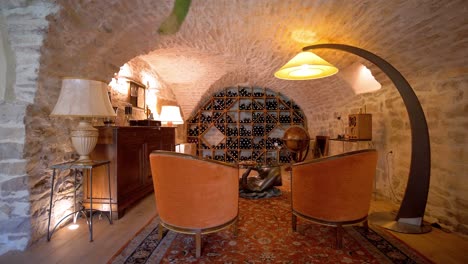 Exploration-shot-of-a-luxury-basement-wine-cellar-and-sitting-area