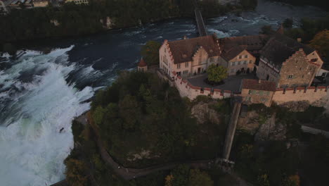 aerial-shot-over-the-castle-of-Laufen
and-where-you-can-see-the-falls-of-the-Rhine-River-and-the-bridge-that-crosses-it