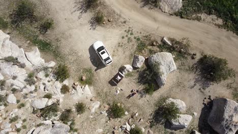Aerial-top-view-descending-above-people-camping-in-Native-American-Blair-Valley