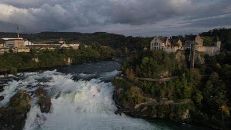 Fantastic-panoramic-aerial-shot-in-the-middle-distance-of-the-falls-of-the-Rhine-and-where-the-castle-of-Laufen-can-be-seen