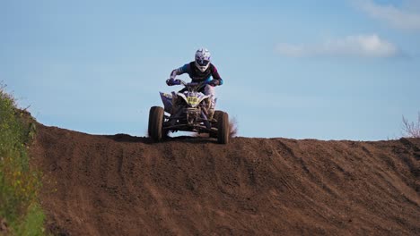 One-Quad-Racer-Jumping-From-Slope-on-Dirt-Road-Trail-in-Extreme-Slow-Motion