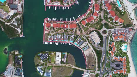 Expensive-resorts-at-the-Cap-Cana-Marina,-in-sunny-Punta-Cana,-Dominican-Republic---birds-eye,-aerial-view