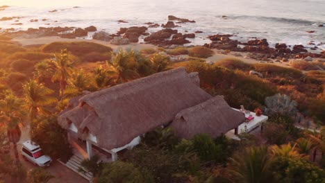 Sun-rises-as-drone-spins-around-beautiful-waterfront-luxury-rental-villas-in-Oaxaca-Mexico