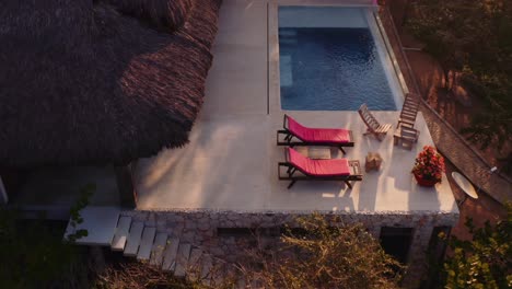 Slow-drone-forward-towards-luxury-rental-villa-with-pool-in-Oaxaca-mexico-Pacific-Ocean-4k-aerial