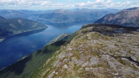 Incredible-panoramic-fjord-view-from-above-Lofthus-and-queens-hiking-trail-in-Hardanger-Norway---Sorfjorden-Hardangerfjord-and-fjord-leading-to-Eidfjord-seen-below---Aerial