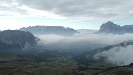 Aerial-view-of-the-mountains-in-Dolomites-above-the-fog-in-the-morning