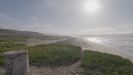 Slow-motion-panning-shot-of-a-sunny-day-at-Marina-State-Beach-Monterey-Bay-California