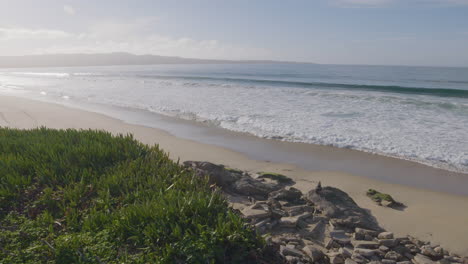 Slow-motion-shot-of-a-sunny-day-at-California-Monterey-Bay-Marina-State-Beach