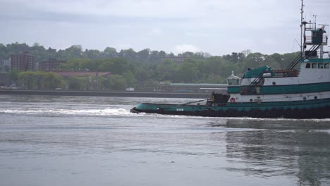 tug-boat-towing-larger-ship