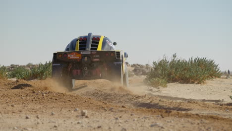 Dakar-Race-Car-Taking-Sandy-Turn-With-Dust-At-Dakar-Rally-Event
