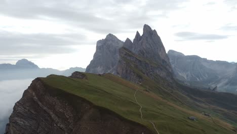 Orbit-drone-shot-of-a-cloudy-morning-in-the-Dolomites-mountains-in-Italy