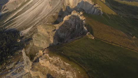 Aerial-reveal-shot-of-a-top-of-a-mountain-in-Dolomites-zone-italy-in-a-sunny-morning